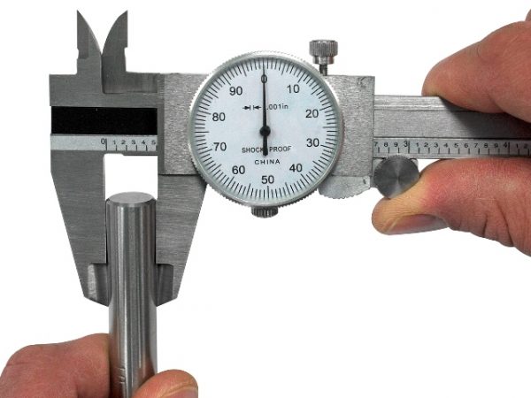 990-PG1 Hands-On Skill Showing a Dial Caliper Measuring with Outside Jaws